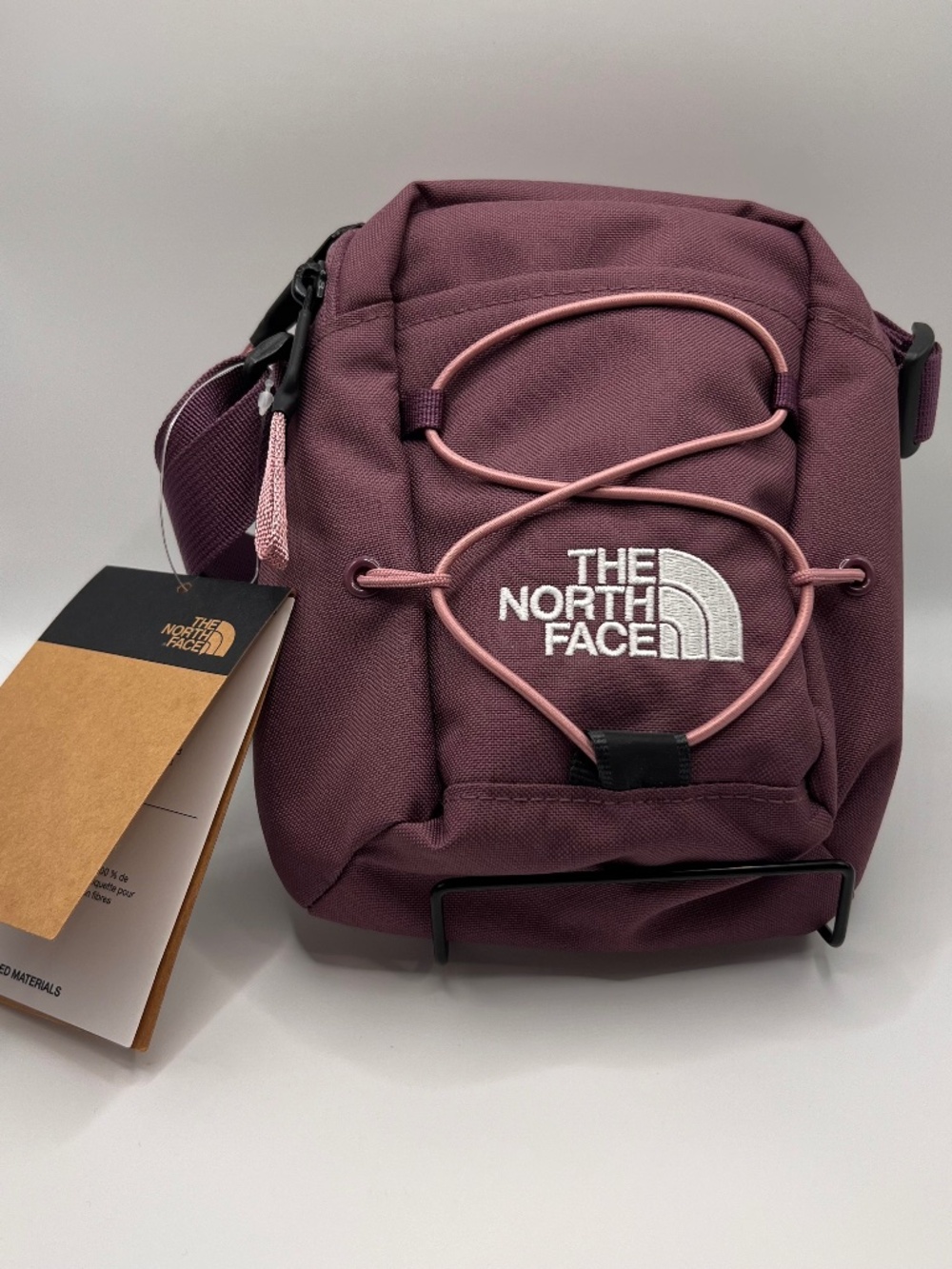 The North Face Jester Crossbody Mauve with White Logo.NWT. Front Securing Bungee